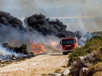 Firemen are preparing to fight the flames in Limassol, Cyprus, on May 31, 2024. Some buildings are in danger after a fire breaks out in the...