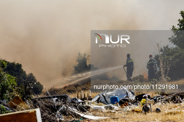 Firemen are operating in the area in Limassol, Cyprus, on May 31, 2024. Some buildings are in danger after a fire breaks out in the Agios Si...