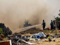 Firemen are operating in the area in Limassol, Cyprus, on May 31, 2024. Some buildings are in danger after a fire breaks out in the Agios Si...