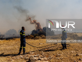 Firemen are operating in the area in Limassol, Cyprus, on May 31, 2024. Some buildings are in danger after a fire breaks out in the Agios Si...