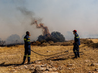 Firemen are operating in the area in Limassol, Cyprus, on May 31, 2024. Some buildings are in danger after a fire breaks out in the Agios Si...