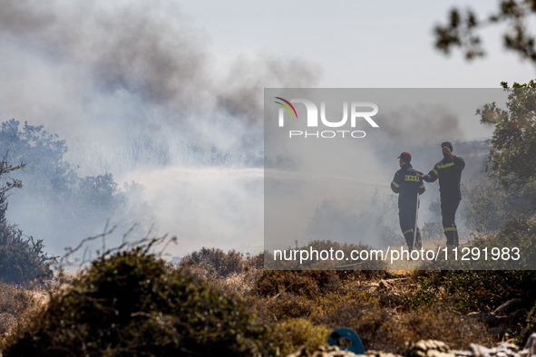 Firemen are operating in the area in Limassol, Cyprus, on May 31, 2024. Some buildings are in danger after a fire breaks out in the Agios Si...