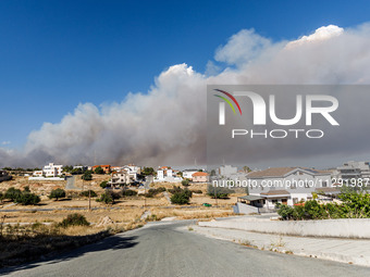 Smoke is being seen in the distance behind the inhabited area in Limassol, Cyprus, on May 31, 2024. Some buildings are being endangered afte...