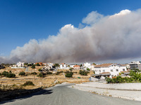 Smoke is being seen in the distance behind the inhabited area in Limassol, Cyprus, on May 31, 2024. Some buildings are being endangered afte...