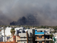 Smoke is being seen in the distance behind the inhabited area in Limassol, Cyprus, on May 31, 2024. Some buildings are being endangered afte...