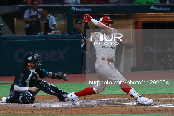 Julian Ornelas #31 of Diablos Rojos is hitting the ball during the Saraperos de Saltillo v Diablos Rojos del Mexico match 2 of the Mexican B...