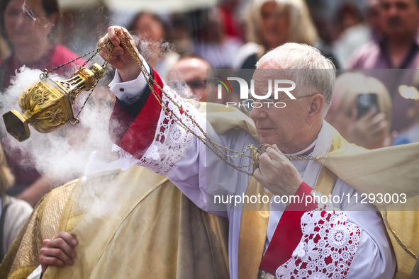 Archbishop Marek Jedraszewski celebrates Corpus Christi procession in Krakow, Poland on May 30, 2024. The procession starts with a priest ca...