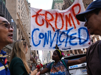 Anti-Trump protesters are standing outside as former president Donald Trump is making a statement after a guilty verdict at Trump Tower in N...