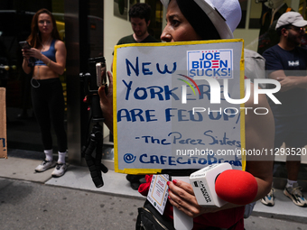 Anti-Trump protesters are standing outside as former president Donald Trump is making a statement after a guilty verdict at Trump Tower in N...