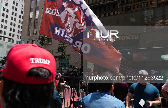 Trump supporters are standing outside as former president Donald Trump is making a statement after a guilty verdict at Trump Tower in New Yo...