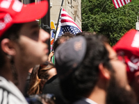 Trump supporters are standing outside as former president Donald Trump is making a statement after a guilty verdict at Trump Tower in New Yo...