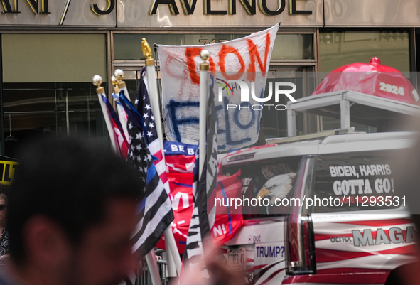 Anti-Trump protesters are standing outside as former president Donald Trump is making a statement after a guilty verdict at Trump Tower in N...