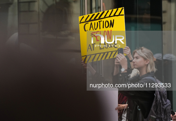 Anti-Trump protesters are standing outside as former president Donald Trump is making a statement after a guilty verdict at Trump Tower in N...