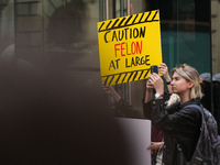 Anti-Trump protesters are standing outside as former president Donald Trump is making a statement after a guilty verdict at Trump Tower in N...