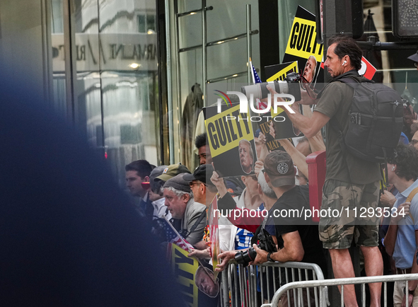 The media is standing outside as former president Donald Trump is making a statement after the guilty verdict at Trump Tower in New York Cit...