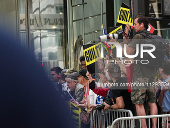 The media is standing outside as former president Donald Trump is making a statement after the guilty verdict at Trump Tower in New York Cit...