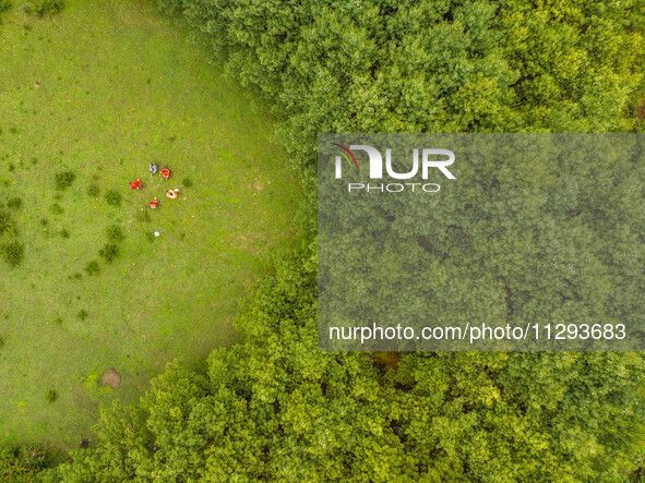 Forest rangers are resting on a forest patrol in Bijie, Guizhou province, China, on May 31, 2024. 