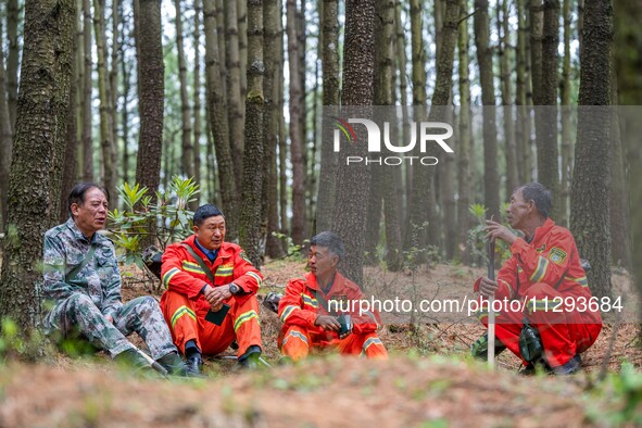 Forest rangers are resting on a forest patrol in Bijie, Guizhou province, China, on May 31, 2024. 