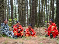 Forest rangers are resting on a forest patrol in Bijie, Guizhou province, China, on May 31, 2024. (