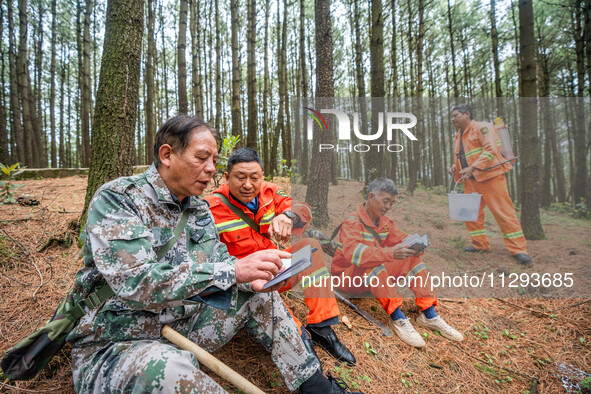 Forest rangers are resting on a forest patrol in Bijie, Guizhou province, China, on May 31, 2024. 