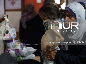 A Palestinian child is suffering from malnutrition and is receiving treatment at Al-Aqsa Martyrs Hospital in Deir al-Balah in the central Ga...