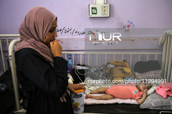 A Palestinian child is suffering from malnutrition and is receiving treatment at Al-Aqsa Martyrs Hospital in Deir al-Balah in the central Ga...