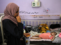 A Palestinian child is suffering from malnutrition and is receiving treatment at Al-Aqsa Martyrs Hospital in Deir al-Balah in the central Ga...