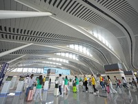 Simulated passengers are entering the departure hall of T2 Terminal of Yantai Penglai International Airport in Yantai, China, on June 1, 202...