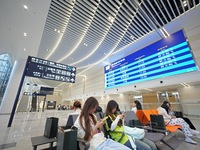 Simulated passengers are resting at the assembly point in the arrival hall of T2 Terminal of Yantai Penglai International Airport in Yantai,...