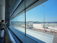 Simulated passengers are taking photos of the tarmac at the T2 terminal of Yantai Penglai International Airport in Yantai, China, on June 1,...