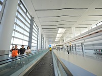 Simulated passengers are making their way to the boarding gate at the T2 terminal of Yantai Penglai International Airport in Yantai, China,...