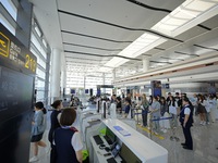 Simulated passengers are boarding a plane at the T2 terminal of Yantai Penglai International Airport in Yantai, China, on June 1, 2024. (