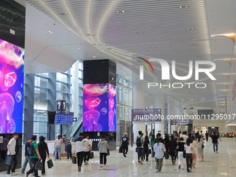 Simulated passengers are preparing for departure at the arrival hall of T2 Terminal of Yantai Penglai International Airport in Yantai, China...