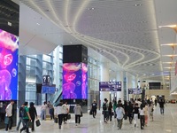 Simulated passengers are preparing for departure at the arrival hall of T2 Terminal of Yantai Penglai International Airport in Yantai, China...