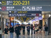 Simulated passengers are making their way to the boarding gate at the T2 terminal of Yantai Penglai International Airport in Yantai, China,...