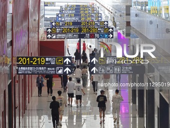 Simulated passengers are making their way to the boarding gate at the T2 terminal of Yantai Penglai International Airport in Yantai, China,...