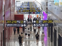 Simulated passengers are making their way to the boarding gate at the T2 terminal of Yantai Penglai International Airport in Yantai, China,...