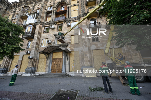 Municipal workers are dealing with the consequences of the Russian missile attack in Zaporizhzhia, southeastern Ukraine, on June 1, 2024. In...