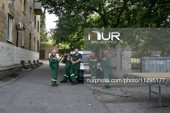 Municipal workers are dealing with the consequences of the Russian missile attack in Zaporizhzhia, southeastern Ukraine, on June 1, 2024. In...