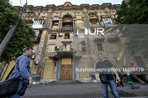 Municipal workers are dealing with the consequences of the Russian missile attack in Zaporizhzhia, southeastern Ukraine, on June 1, 2024. In...