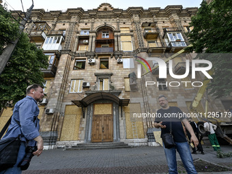 Municipal workers are dealing with the consequences of the Russian missile attack in Zaporizhzhia, southeastern Ukraine, on June 1, 2024. In...