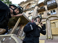 Rescuers are seen outside a residential building after the Russian missile attack in Zaporizhzhia, Ukraine, on June 1, 2024. In Zaporizhzhia...