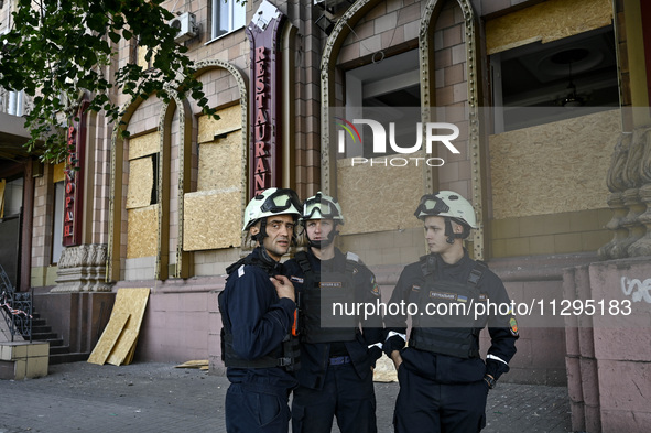 Rescuers are seen outside a residential building after the Russian missile attack in Zaporizhzhia, Ukraine, on June 1, 2024. In Zaporizhzhia...