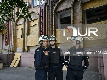 Rescuers are seen outside a residential building after the Russian missile attack in Zaporizhzhia, Ukraine, on June 1, 2024. In Zaporizhzhia...