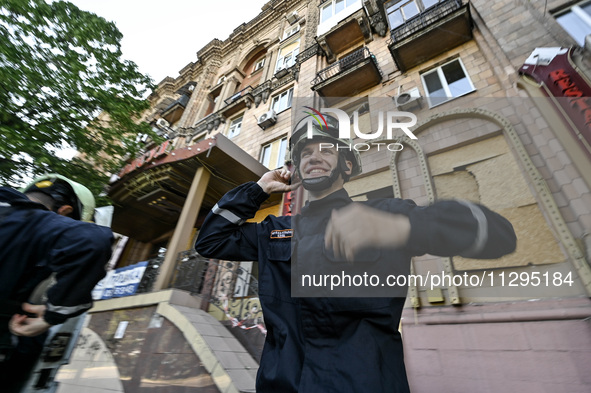 Rescuers are seen outside a residential building after the Russian missile attack in Zaporizhzhia, Ukraine, on June 1, 2024. In Zaporizhzhia...