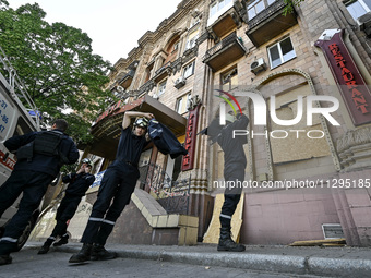 Rescuers are seen outside a residential building after the Russian missile attack in Zaporizhzhia, Ukraine, on June 1, 2024. In Zaporizhzhia...