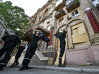 Rescuers are seen outside a residential building after the Russian missile attack in Zaporizhzhia, Ukraine, on June 1, 2024. In Zaporizhzhia...