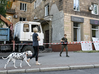 A woman is walking a Dalmatian dog past a residential building after the Russian missile attack in Zaporizhzhia, Ukraine, on June 1, 2024. I...