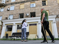 People are staying outside a residential building after the Russian missile attack in Zaporizhzhia, Ukraine, on June 1, 2024. In Zaporizhzhi...