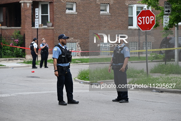 Police officers are gathering at the crime scene for the investigation in Chicago, Illinois, United States, on June 1, 2024. A 40-year-old m...